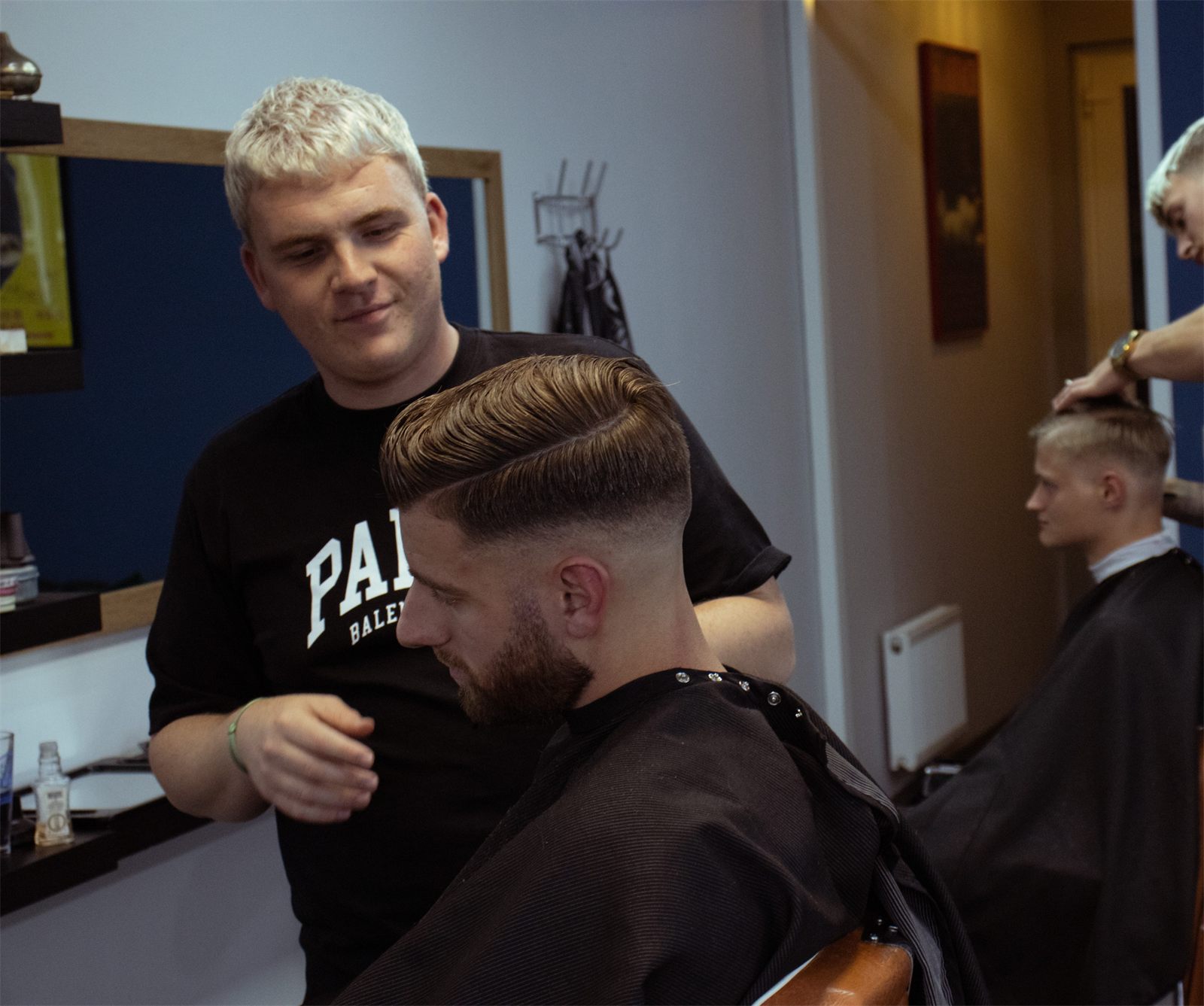 Barber at work at De Barber